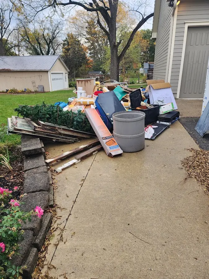 Dumpster being loaded with debris for 3 Yard Dumpster Rental in Holbrook